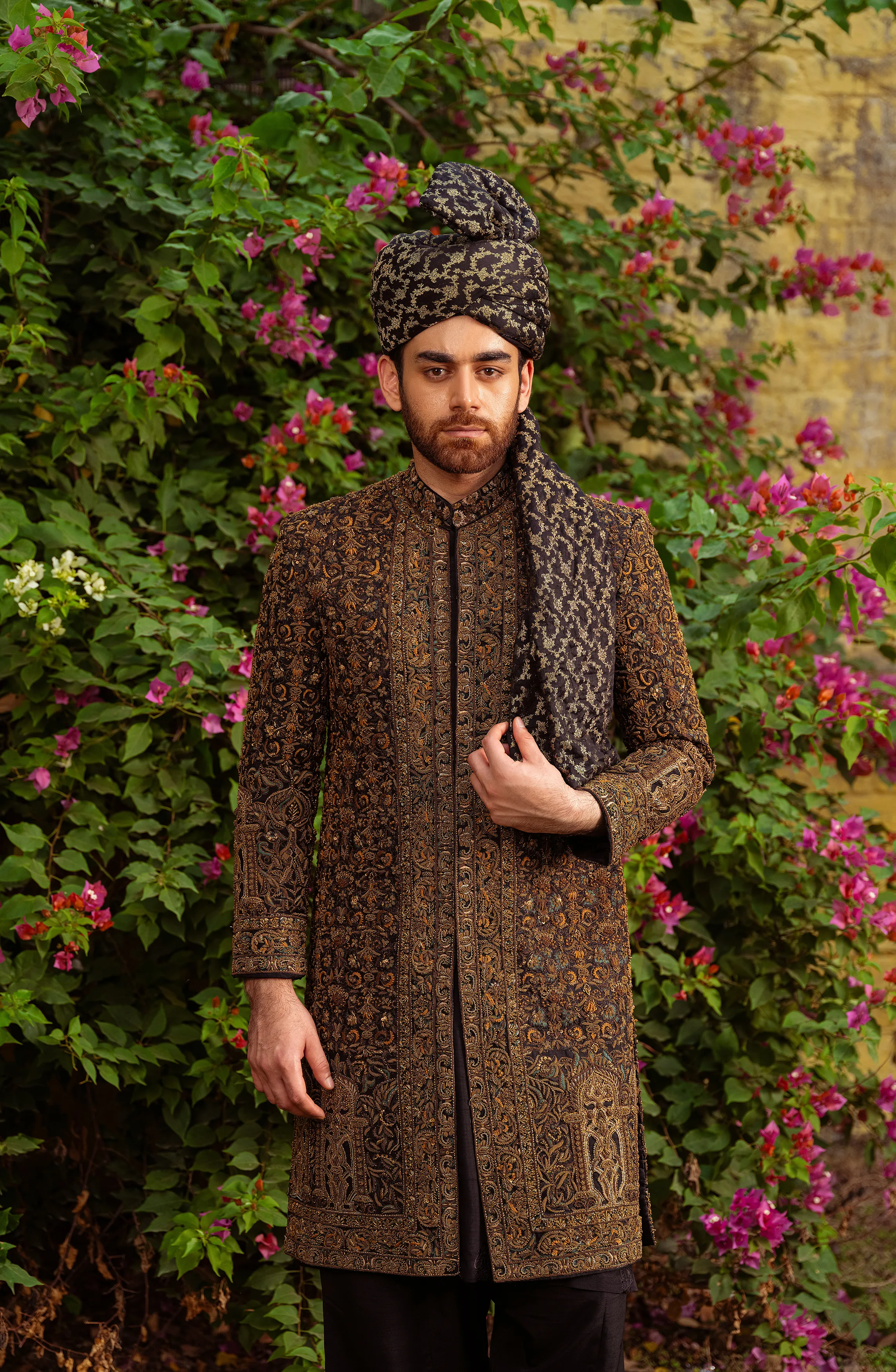 Dastaan - Exquisite Black Silk Sherwani adorned with Antique Gold, Teal & Beige Embroidery